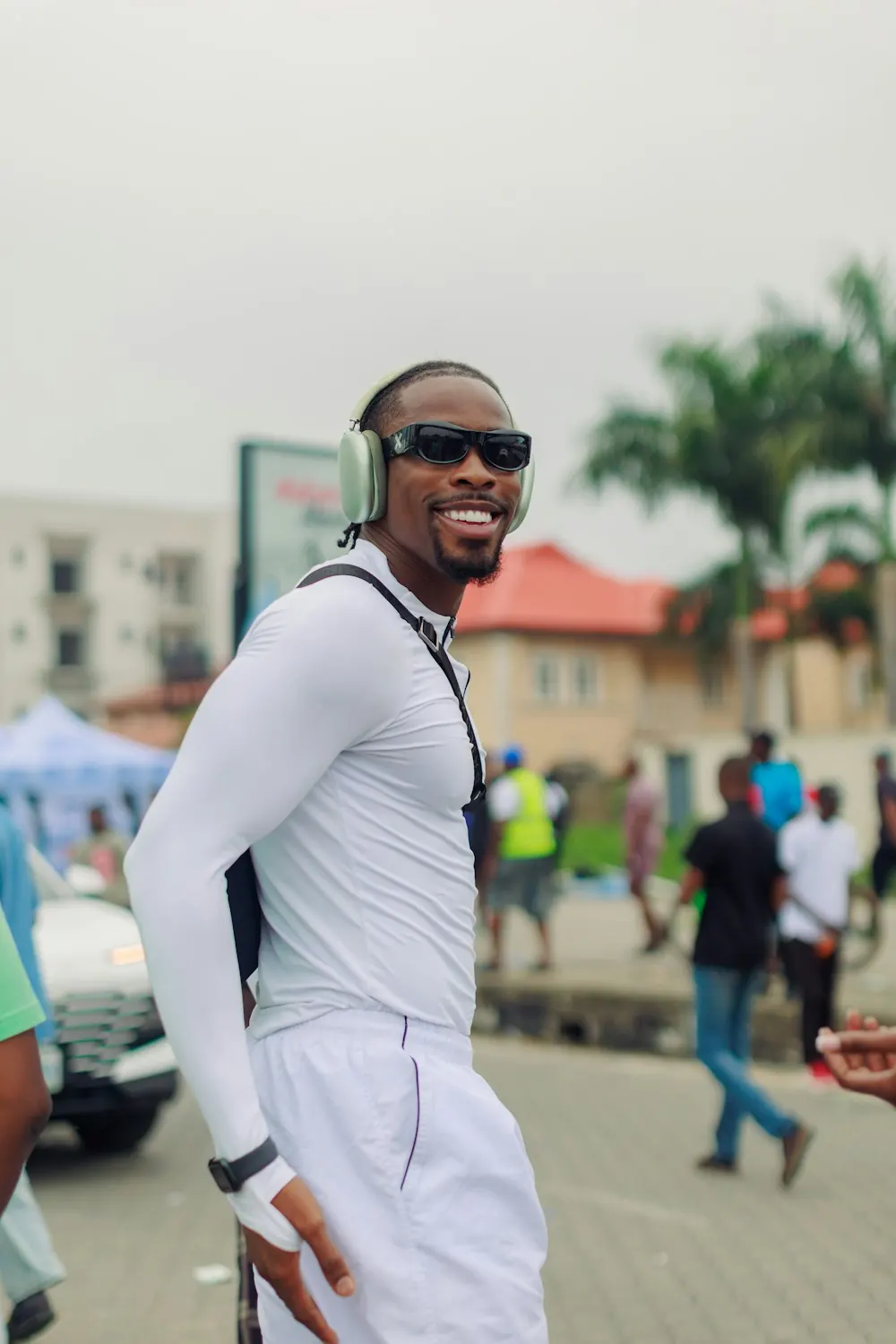 An IRL creator streaming from his phone on a Lagos street