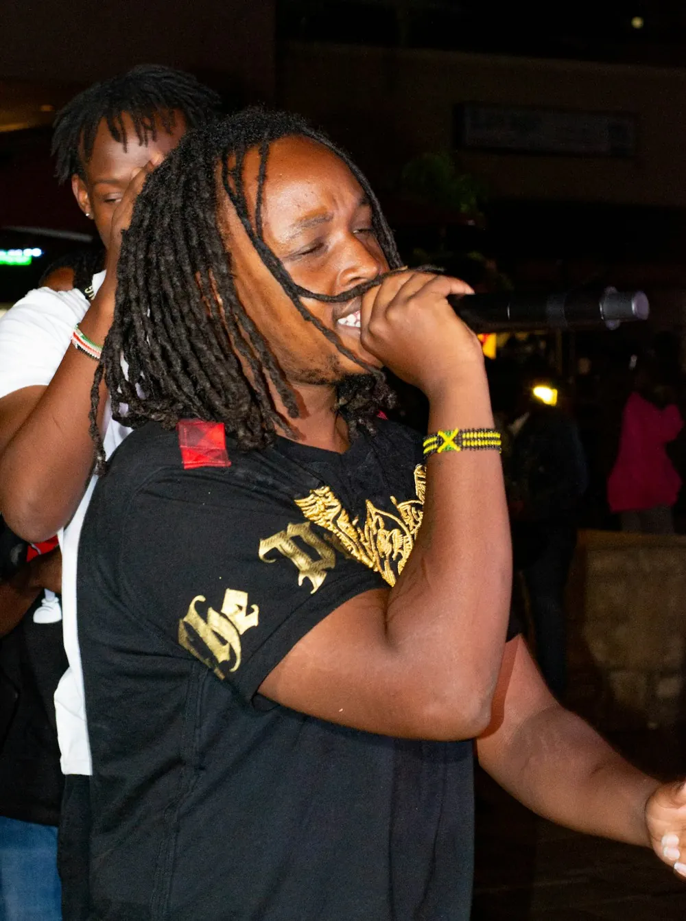 A singer performing live from his phone